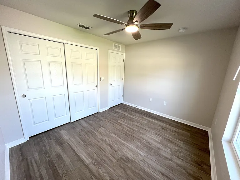 Front bedroom facing entry and closet of similar property
