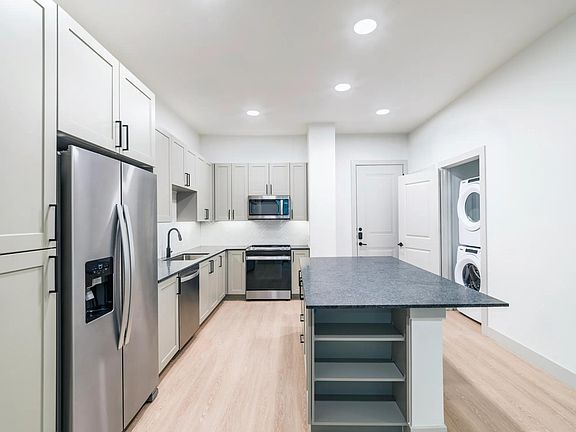Take advantage of ample storage options including dedicated pantry and in island shelving.