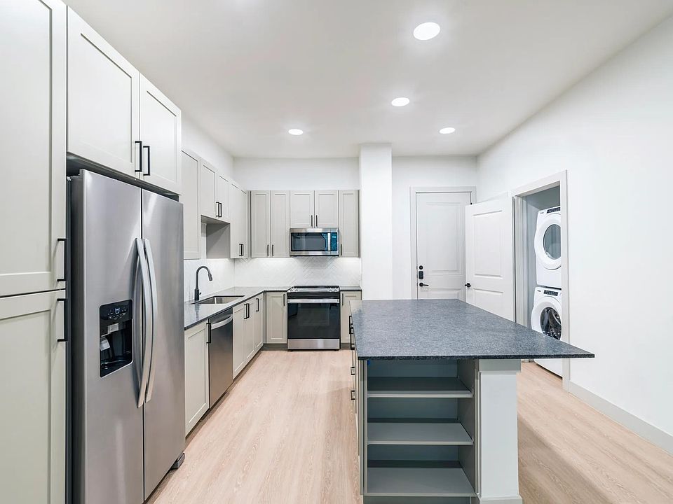 Take advantage of ample storage options including dedicated pantry and in island shelving.