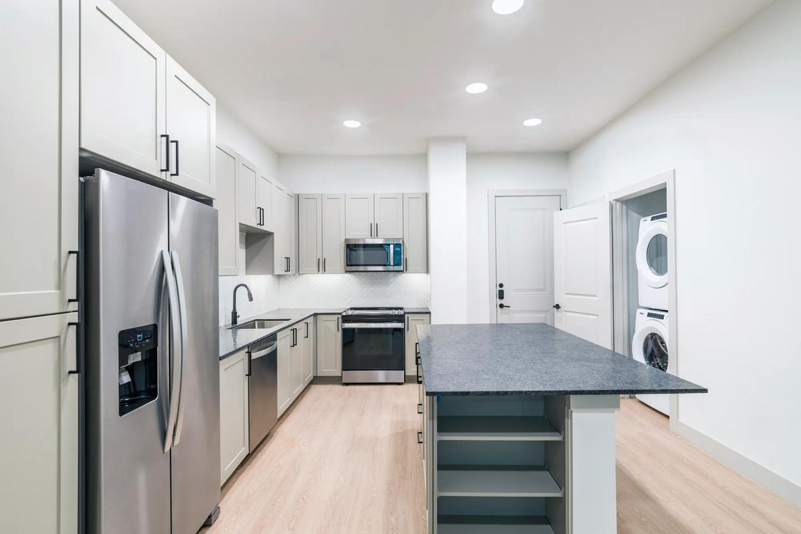 Take advantage of ample storage options including dedicated pantry and in island shelving.