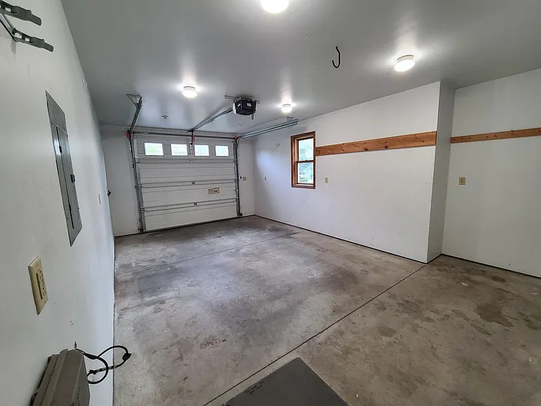 One car garage with extra storage towards the back