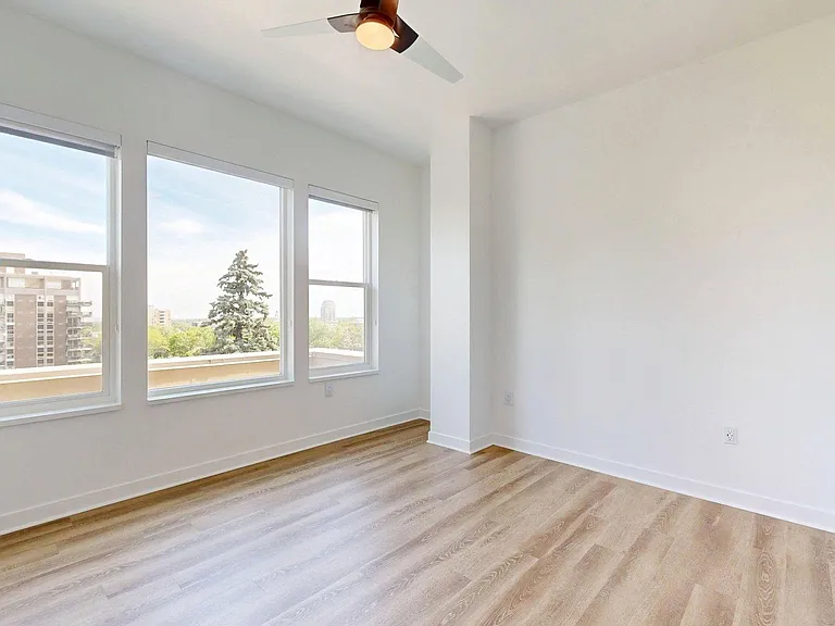 Spacious apartment Bedroom with wood style floor.