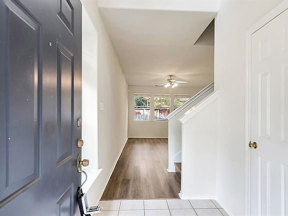 Two story entry with powder room on the right