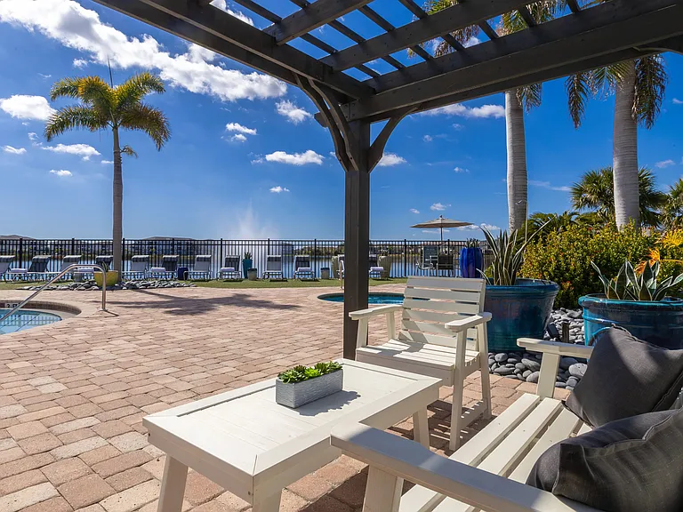 Unwind under the pergola and enjoy a peaceful poolside retreat in under the shade.