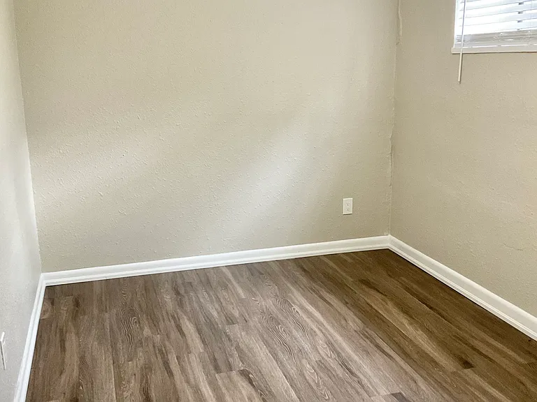 Step into this elegant bedroom featuring stylish wooden flooring and gentle natural lighting. Step into this elegant bedroom featuring stylish wooden flooring and gentle natural lighting.