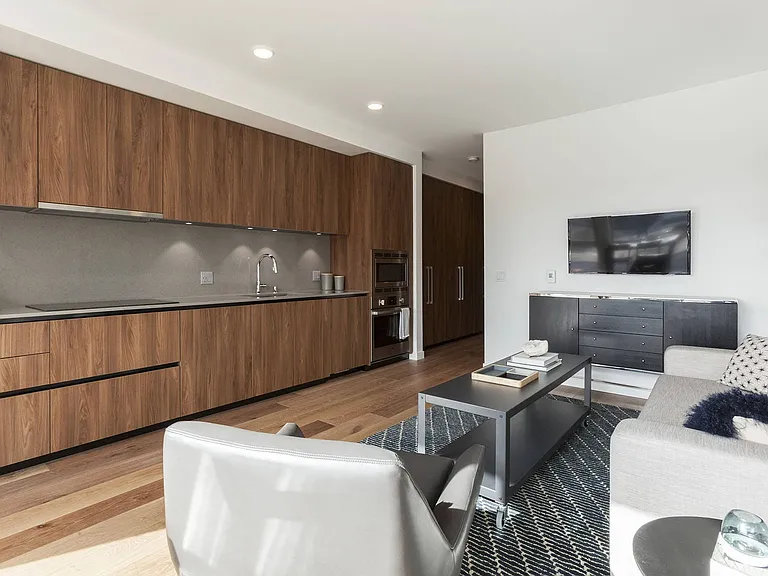 Unit Interior Featuring Full Kitchen Wall and Living Space