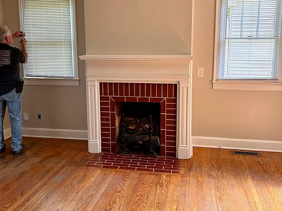 beautiful LR with hardwood floors, just redone, door opening to gorgeous deck, tree lined backyard, fenced for security, privacy.