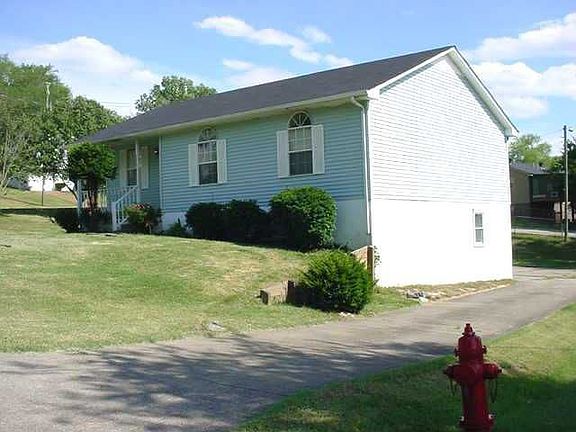 side of home & driveway