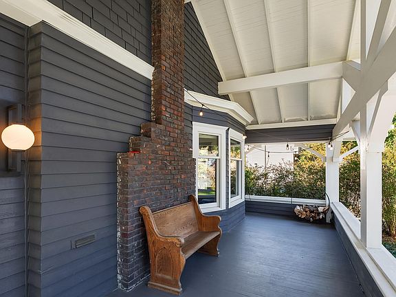 Gorgeous front porch spans the width of the home.