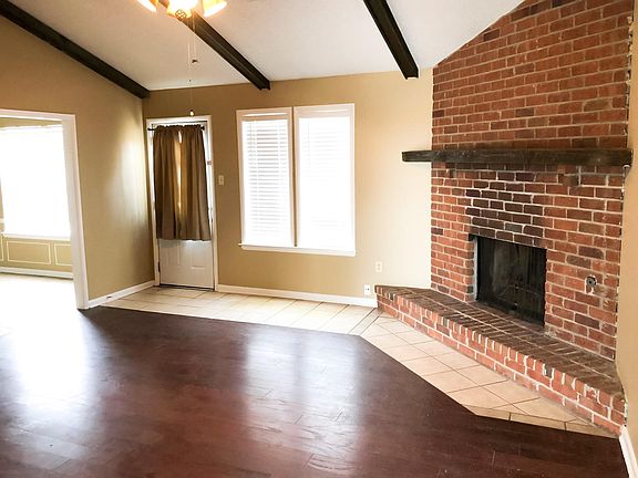 Large living room with fireplace.