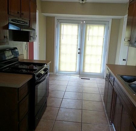 Kitchen
						:
						New Stove & counter tops. Cement tile & new paint. French doors lead to new deck