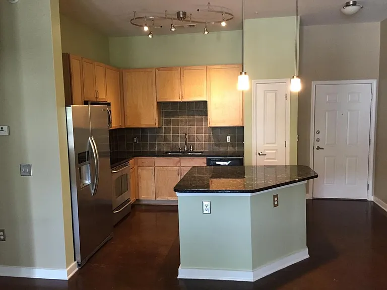 View into kitchen from living room (they are open to each ot