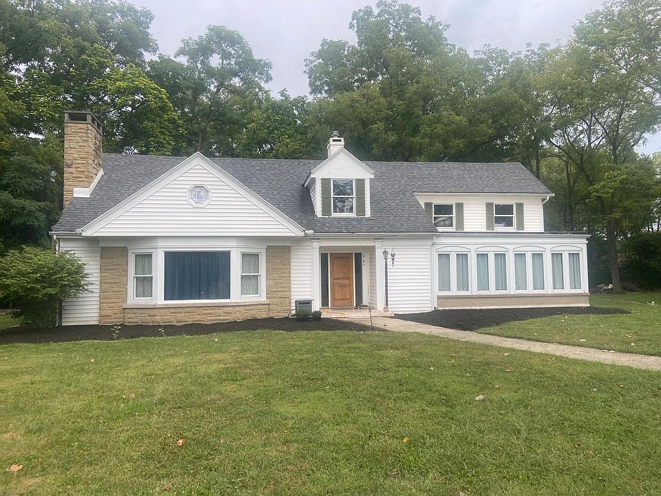House sitting on hill overlooking a 5 acre lot adjacent to Merrimont Hills