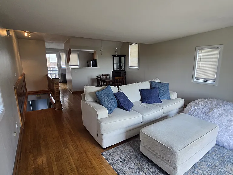 Upper Level Living, Dining and Kitchen with back deck access