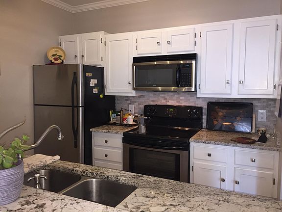 Recently updated, conveniently designed kitchen with granite countertops, stainless appliances, including dishwasher.