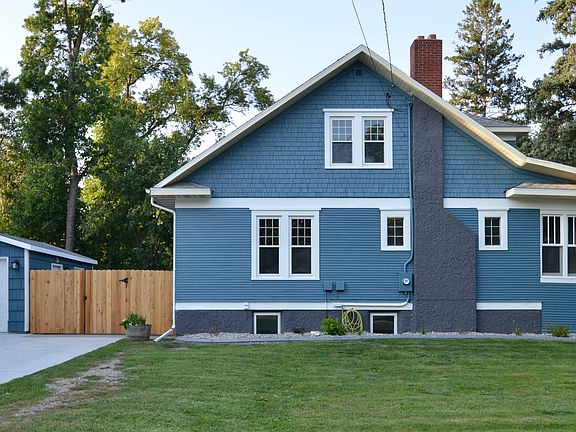 Fully fenced-in back yard & new driveway. Egress windows in the basement, where two bedrooms, a bath, bar & laundry are located.
