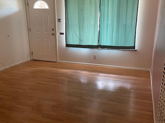 Looking back at front room and front door entrance