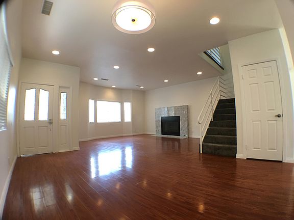 Living Room. Stairs lead up to 4 bedrooms on 2nd floor.