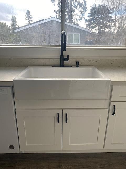 Farm house sink with garbage disposal and new fixtures.