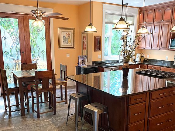 Kitchen/dining eating bar and French doors to private patio.