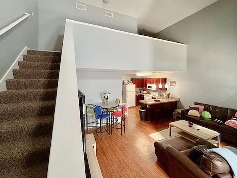 Two story steps to second floor and living room