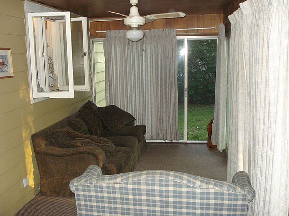 Screened-In Carpeted Back Patio