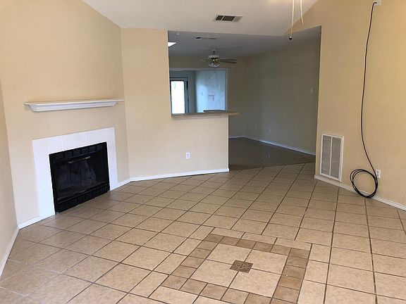 Living Room with Vaulted Ceilings looking into kitchen area