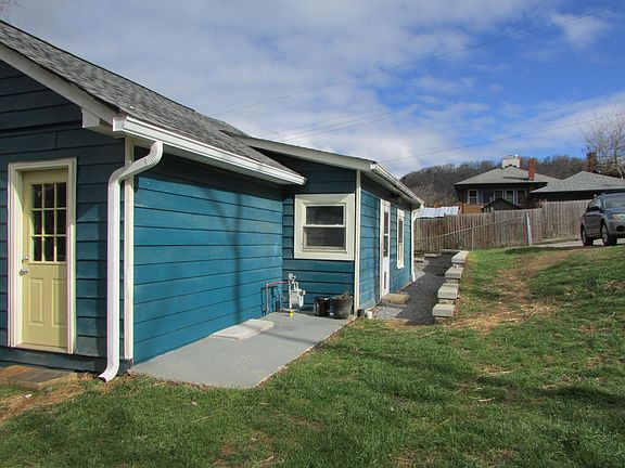 Rear entrance and current parking