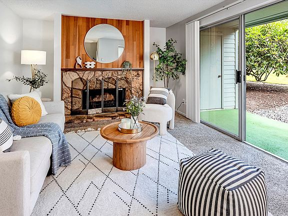 This first floor unit offers double sliding doors to a covered patio and easy access to the grounds, pool, clubhouse and gardens.