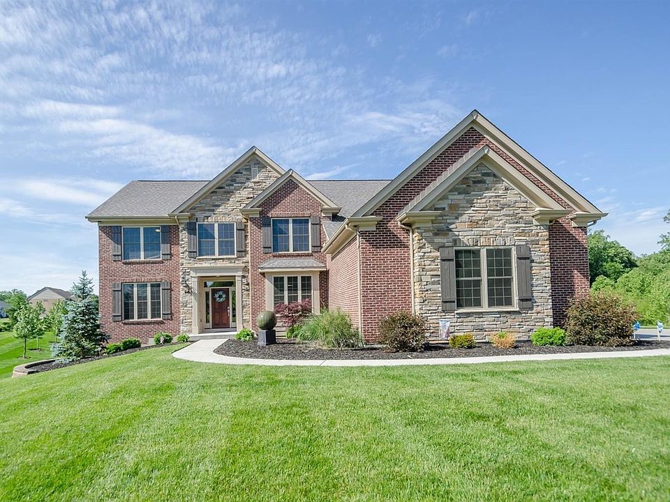 Must see to appreciate all the updates in this home, custom cabinets with decorative range hood, oak hardwood flooring, 1st floor bedroom with full bath large bay window in the family room on the lower level, stone fireplace on the 1st floor great room, m