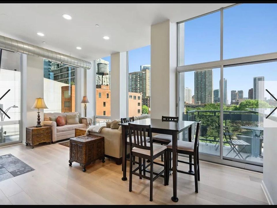 Living/Dining Looking Southeast. Note Hardwood floors and LED flush (Can) lights throughout.