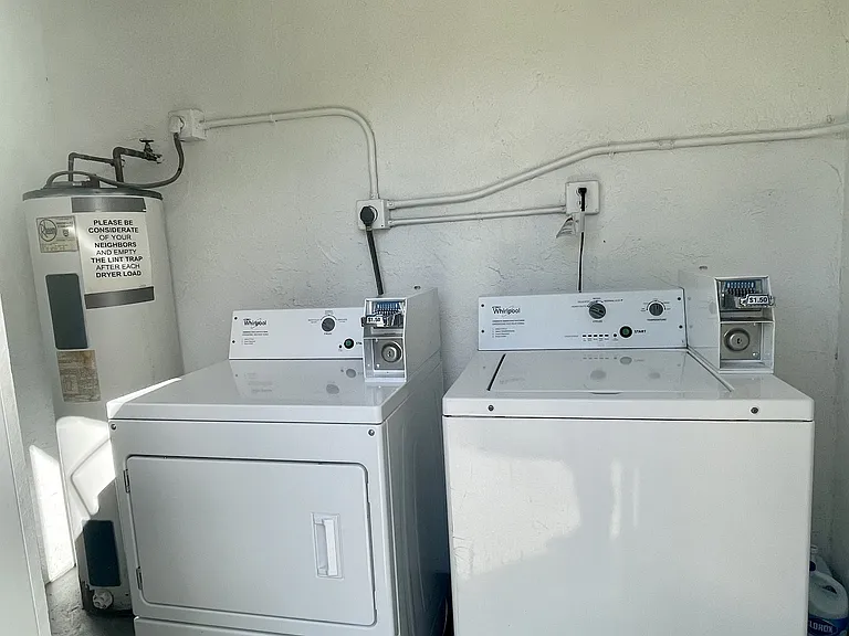 Example of coin-operated washer & dryer that each apartment building has. Townhomes have hookups.