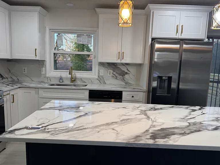newly renovated kitchen, cabinets, island,stainless steel dish washers, and stainless steel refrigerator
