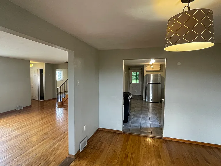 Dining room open to living room and kitchen.