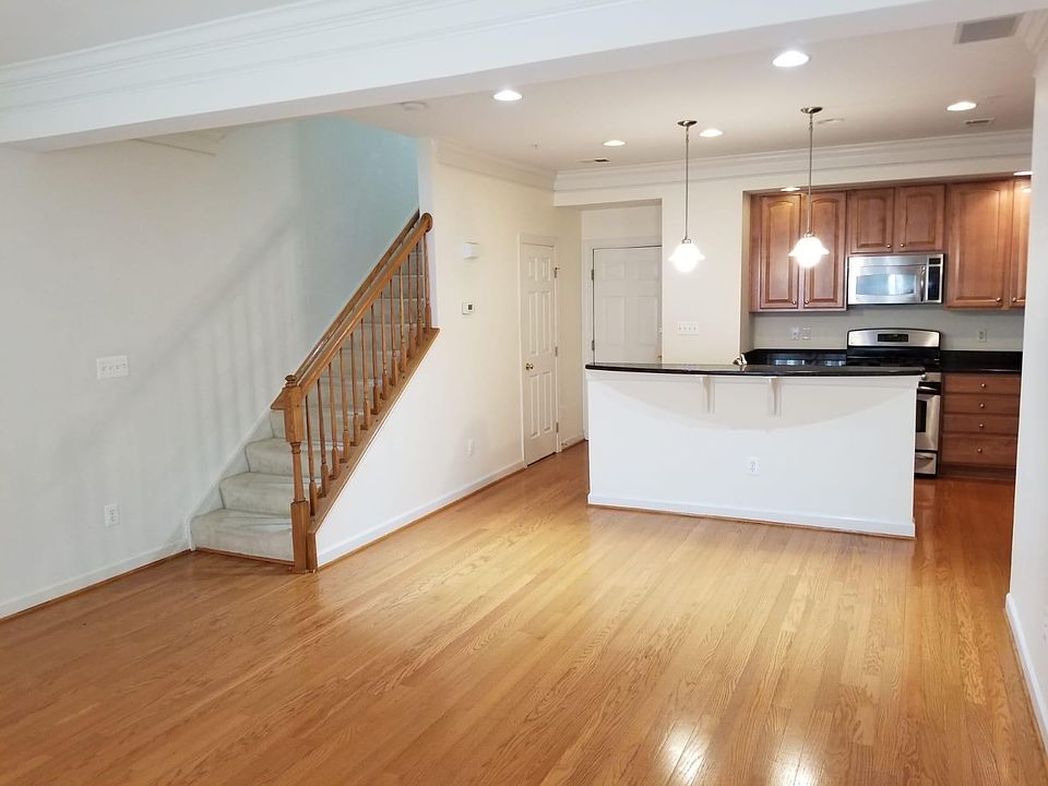 First Floor: Kitchen and Dining Area. Back door opens to garage.