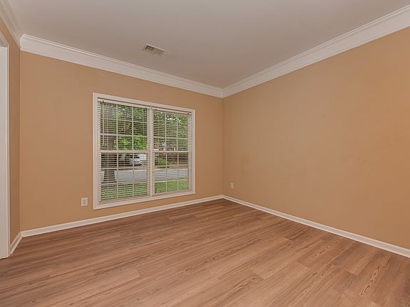 As you enter, on your left, there is a spacious welcome Room (or second dining room or flex room)