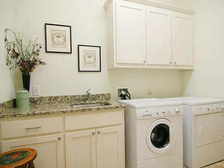 Full size Laundry Room with granite folding area and sink!