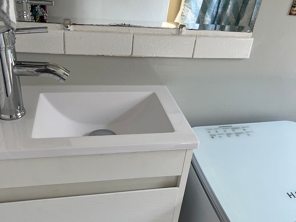 New vanity with sink, and portable clothes washer (new)
