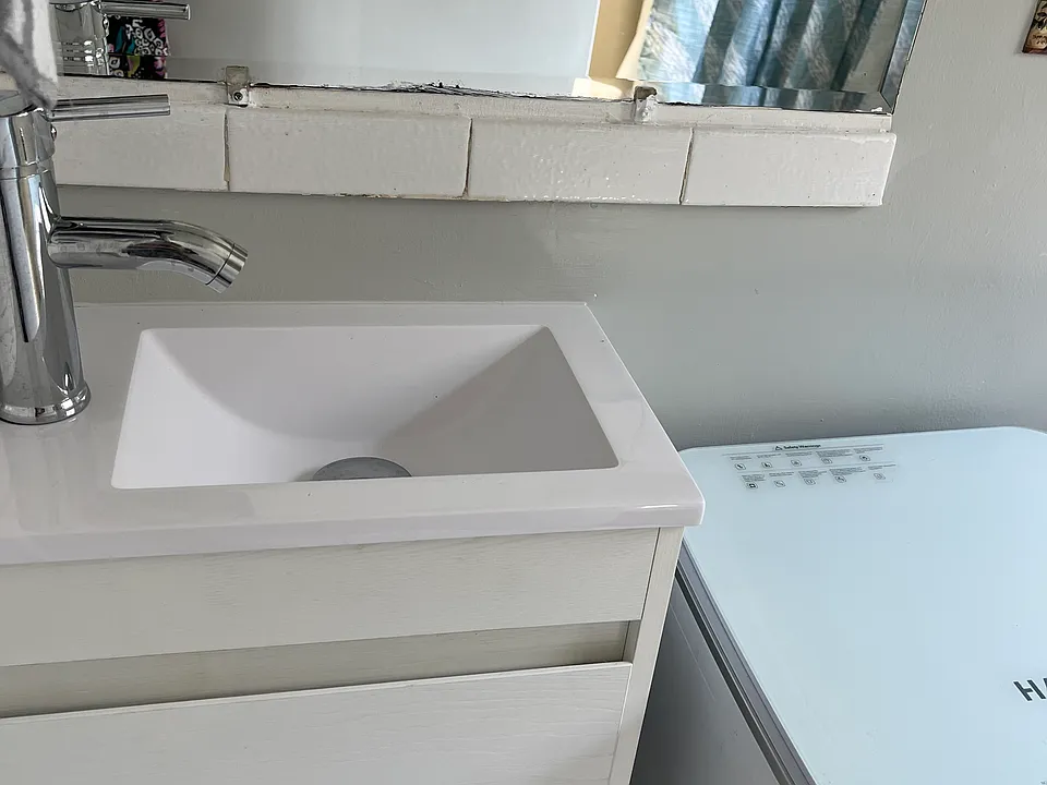 New vanity with sink, and portable clothes washer (new)