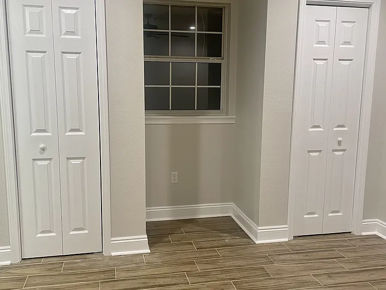Spacious primary bedroom (4/4) with two closets and direct access to the en-suite bathroom for added convenience.