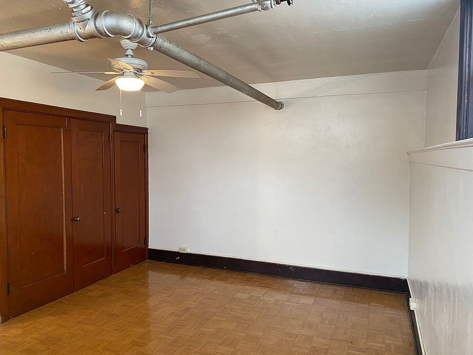 Living space with updated fan and light.
