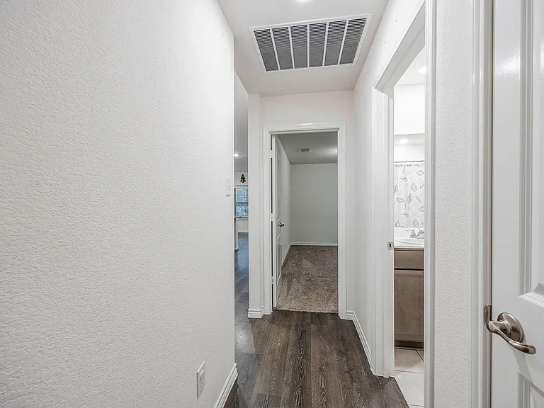 hallway between secondary bedrooms