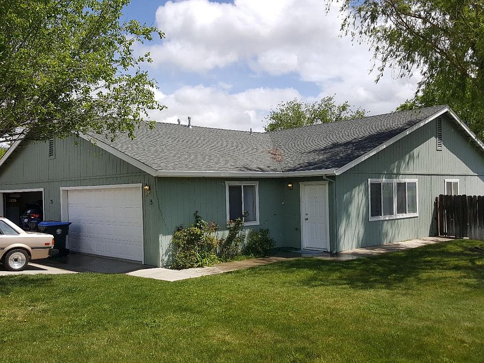 55B Russell Ct front door and 2 car garage door.