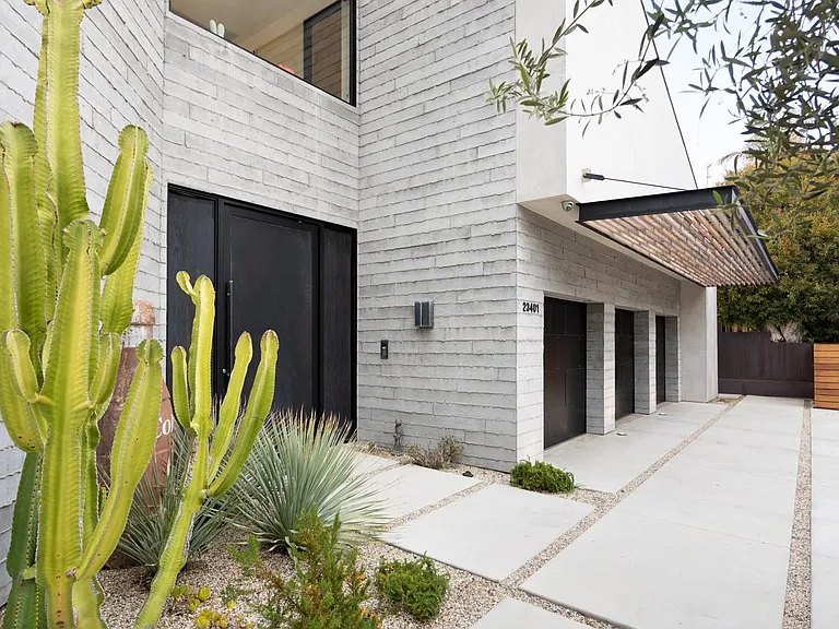 Equipped with A car garage, gym, private surf breaks, and 24-hour security.