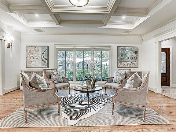 Formal Living: where do you get a box beam 10 foot ceiling with two dramatic living areas complete with gas starter fireplace, spectacular millwork, and designer light fixtures. Note the plentiful lighting with LED, custom privacy duets by Hunter Dou