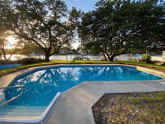 Saltwater pool with shallow and deep end overlooking the Lynnhaven River and your boat docks.