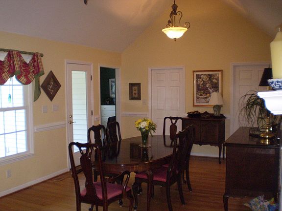 Expansive sitting/dining area flows to kitchen