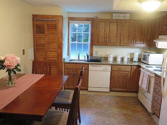 Kitchen, washer dryer is behind louvered doors