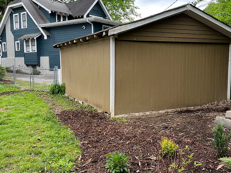 view of the back of the garage before we painted it white