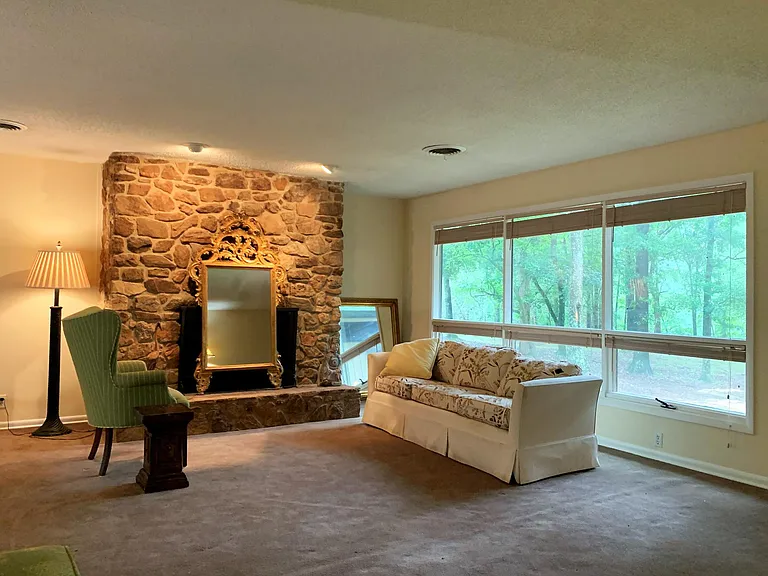 Living Room. Note: carpeting was recently replaced with waterproof laminate flooring. Updated photos to follow.